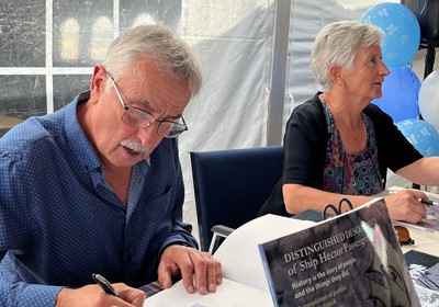 John & Brenda signing books